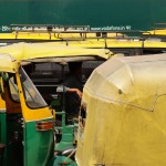 Rickshaws wait for passengers at the New Delhi train station.