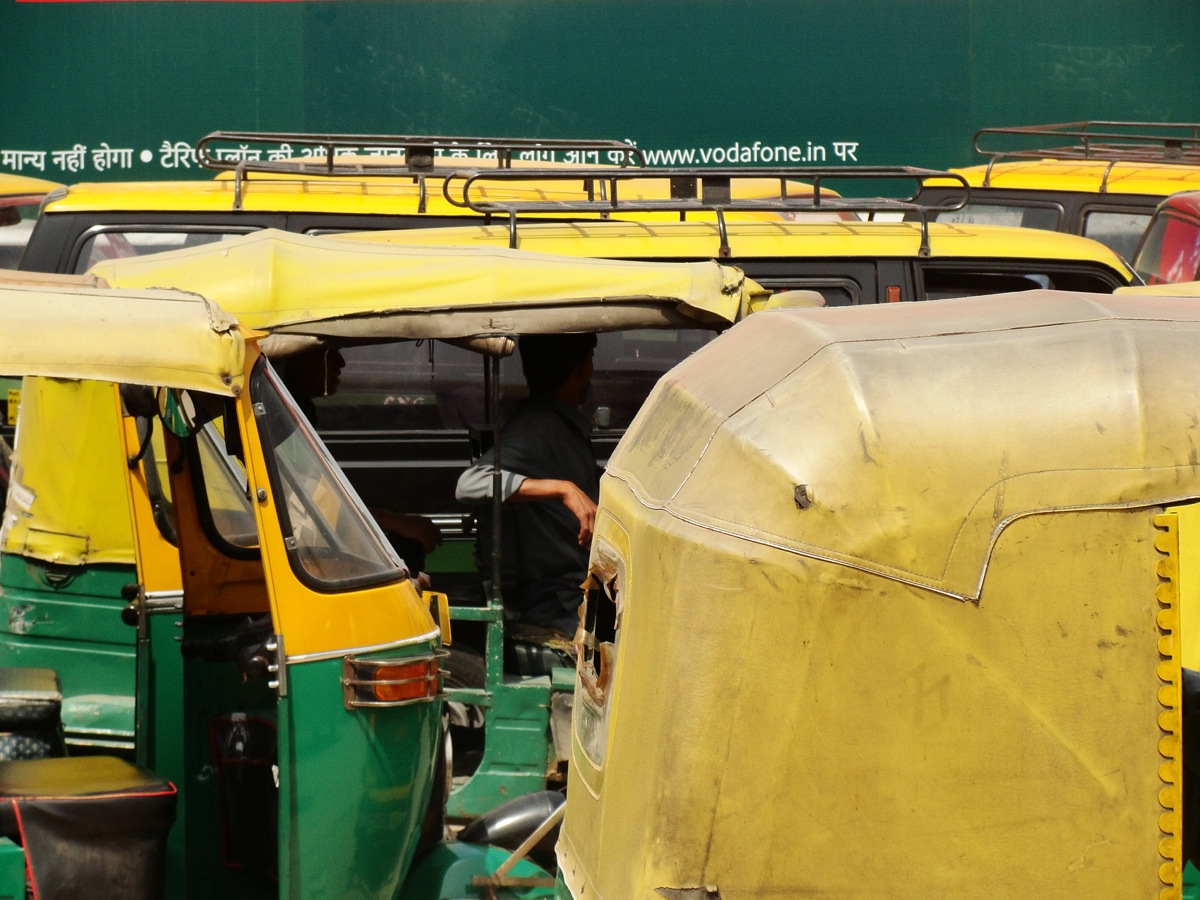 Rickshaws wait for passengers at the New Delhi train station.