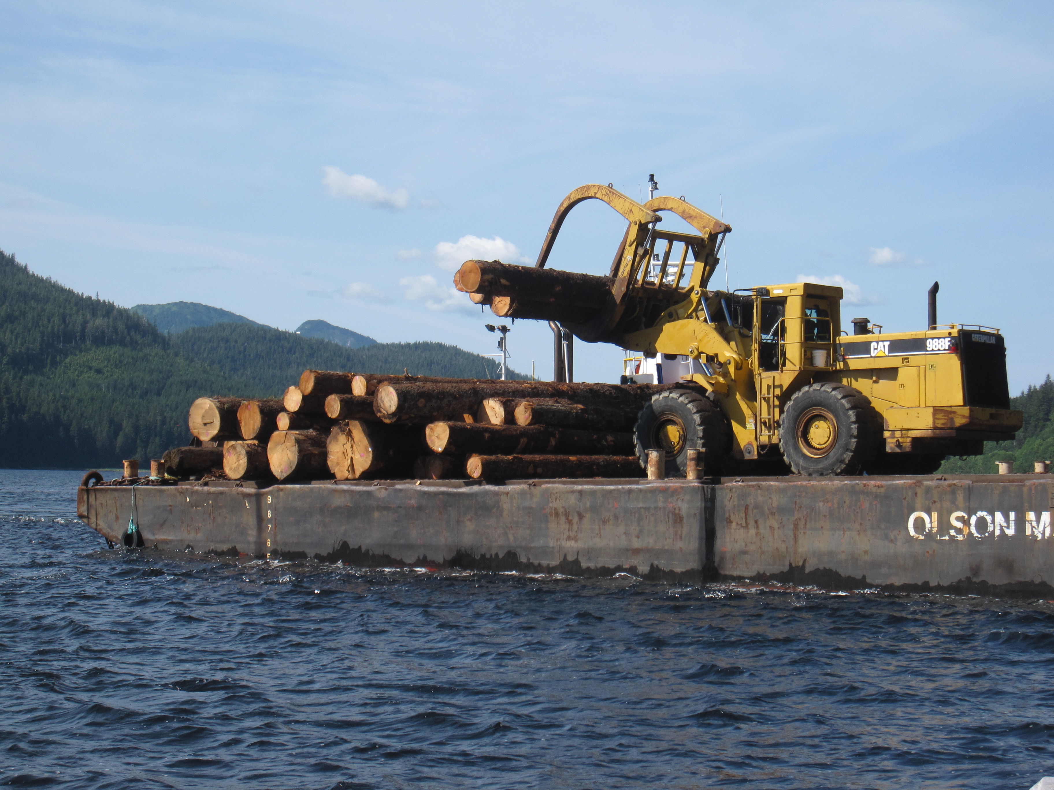 The Sealaska operation in Sitkoh Bay (Chichagof Island) loading their barge with large-diameter logs for transport to Huna, and then most likely to Asia.