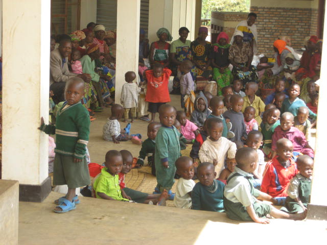 Kids from poor families in Banda wait to receive a free meal from a program operated by Kageno.