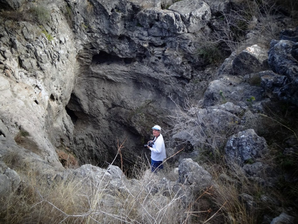 Gregg Eckhardt descends into the Seco Sinkhole to photograph the inner cavities. Photo credit: Ari Phillips.