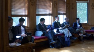 Ambassador Beck sits with students during the 2013 Climate Simulation at Yale University.