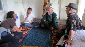 Our team interviews a local community leader in Takob who had helped to kill a snow leopard years ago after it killed several of his neighbor's sheep. Photo courtesy of the author.