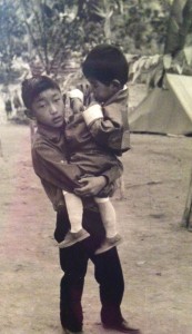 Benji holds his younger cousin, the Fourth King of Bhutan. Photo courtesy of Dasho Benji.