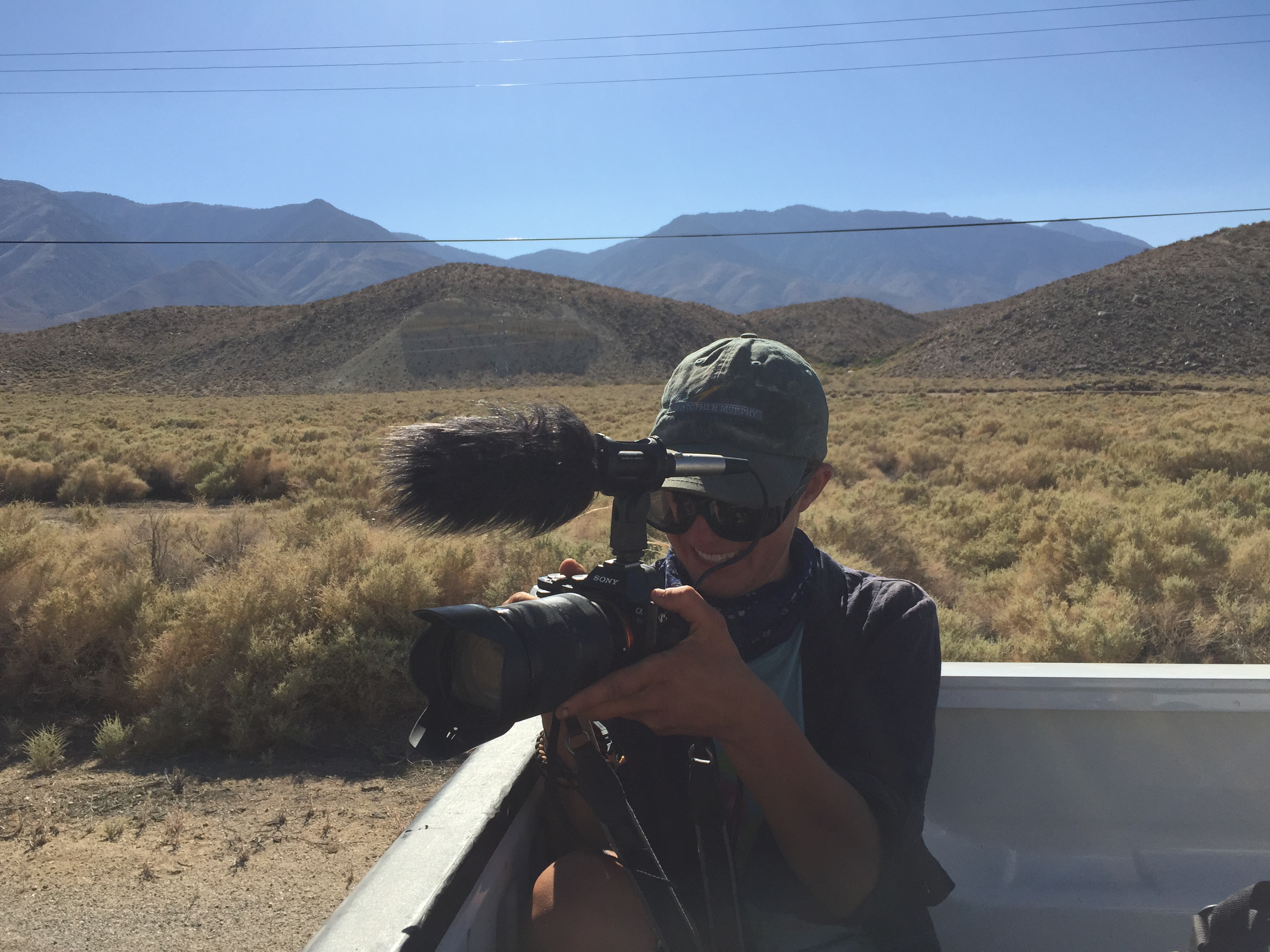 Sam, filming the aqueduct with the eastern Sierras in the background.