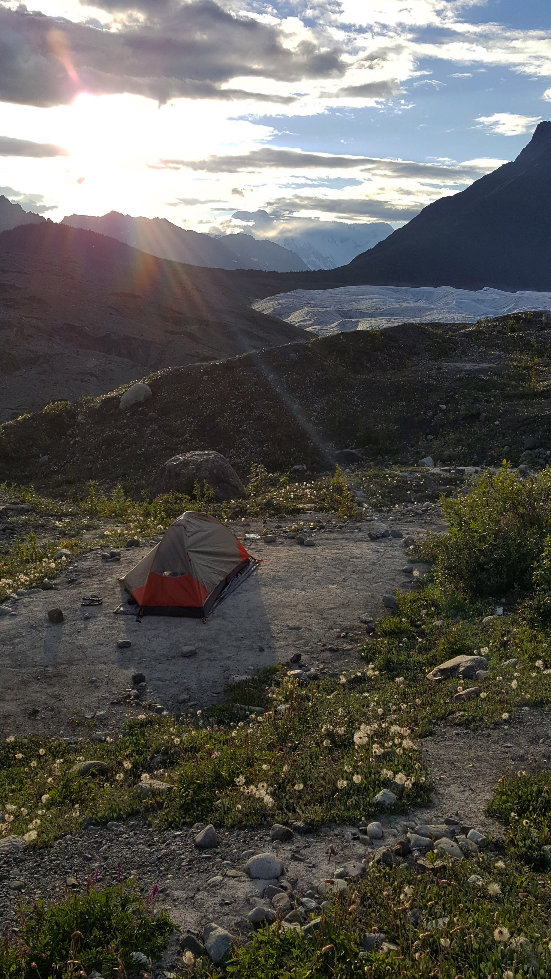 My tent overlooking the Root Glacier and St. Elias Mountain Range. The sun set at about midnight and rose at 4AM, merging dusk and dawn and painting the night sky a light pink.