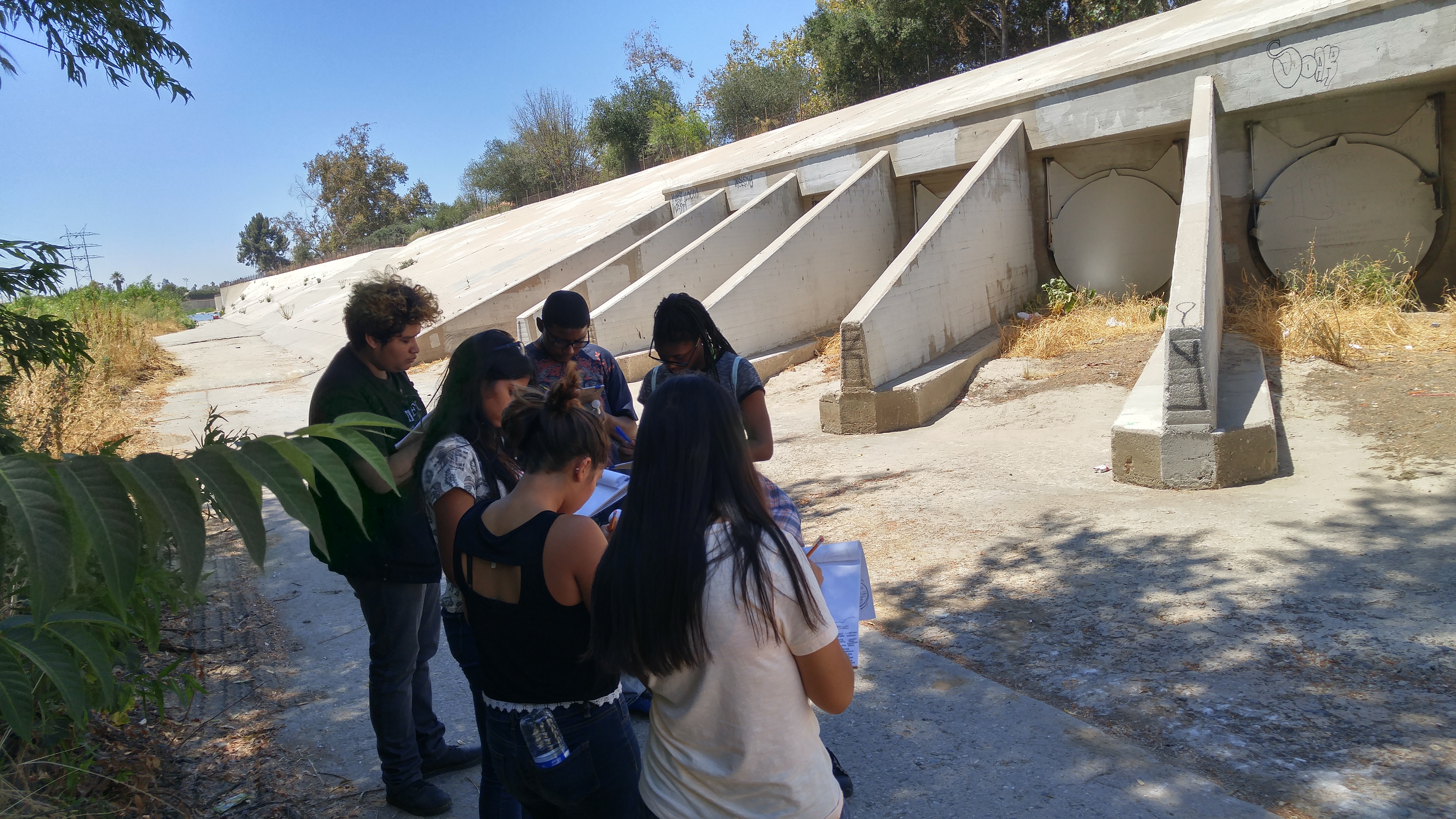 Participants document grey infrastructure along the Los Angeles River. [Photo Credit: Yanin Kramsky]