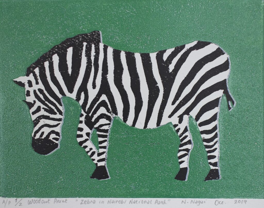 A woodcut print of a zebra with a green background. 